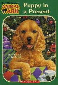 Book cover of Puppy in a Present (Animal Ark #42)