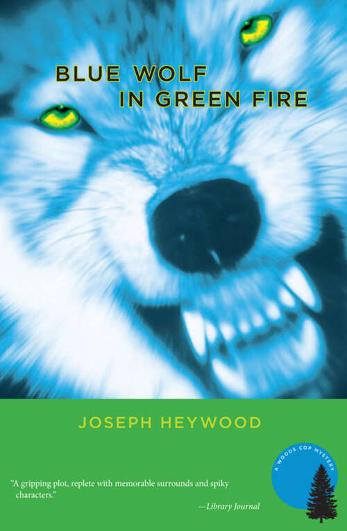 Book cover of Blue Wolf In Green Fire: A Woods Cop Mystery