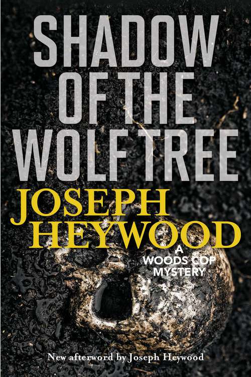 Book cover of Shadow of the Wolf Tree: A Woods Cop Mystery