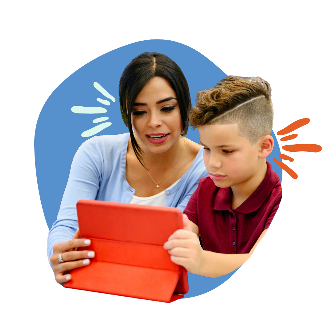 Women and young boy look at a tablet