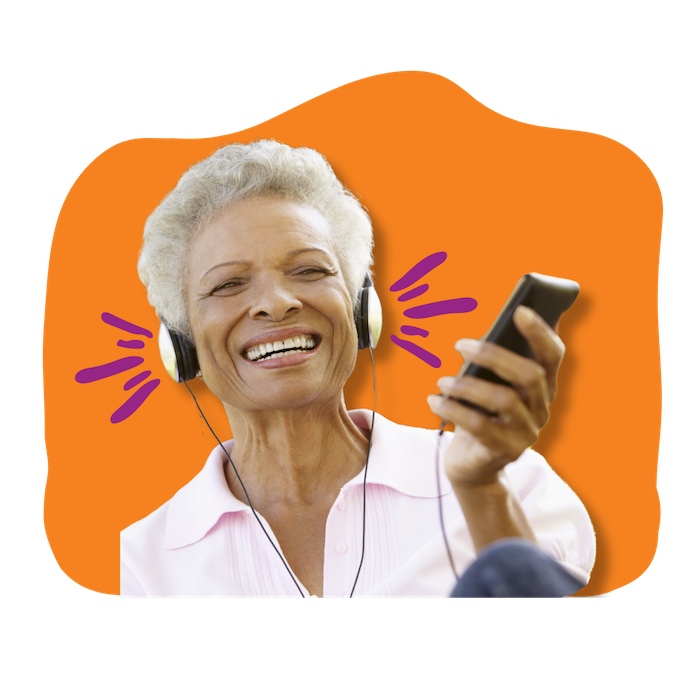 Smiling elderly African American woman smiles and holds a phone