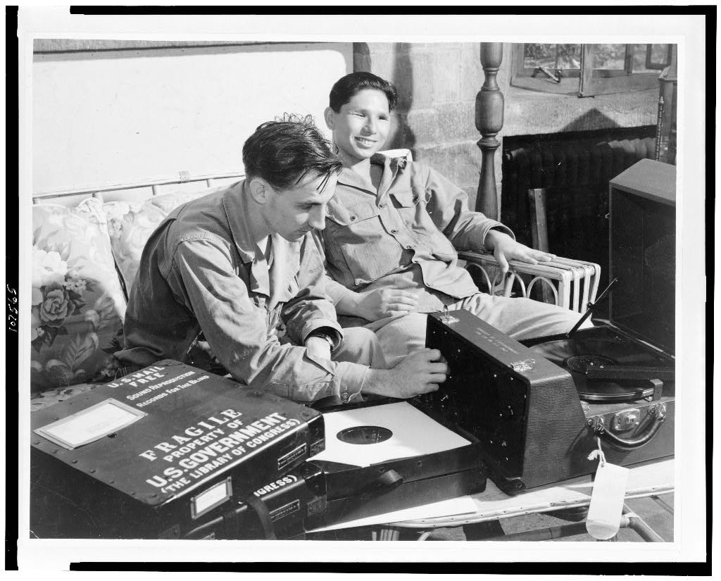 Blinded airman listening to talking book on phonograph